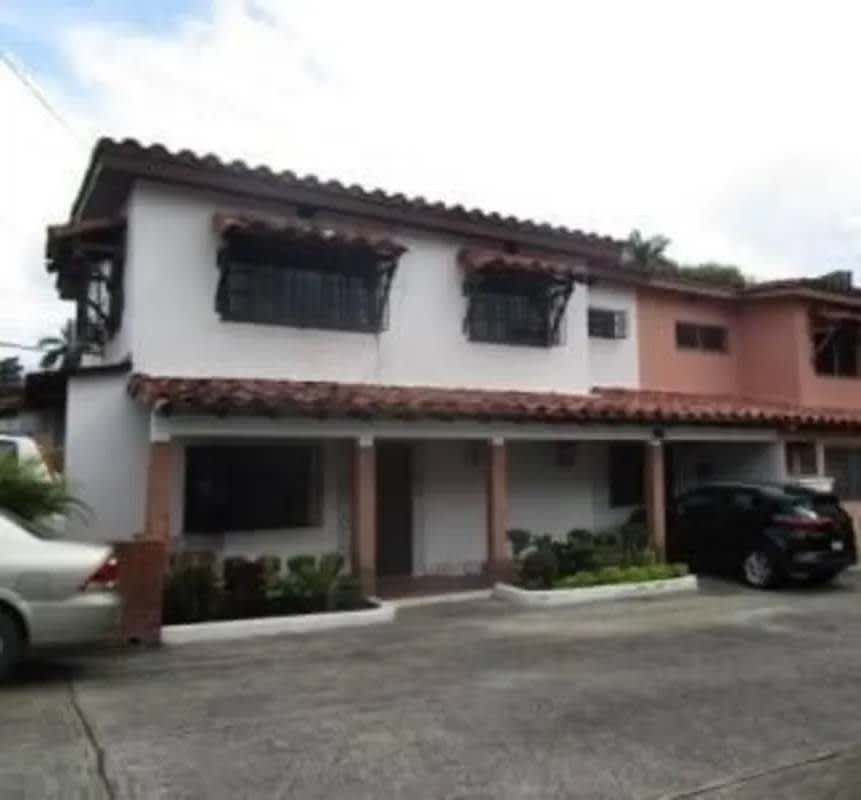 Street level view of two-story house with driveway at PH Via Porras Residences Panama