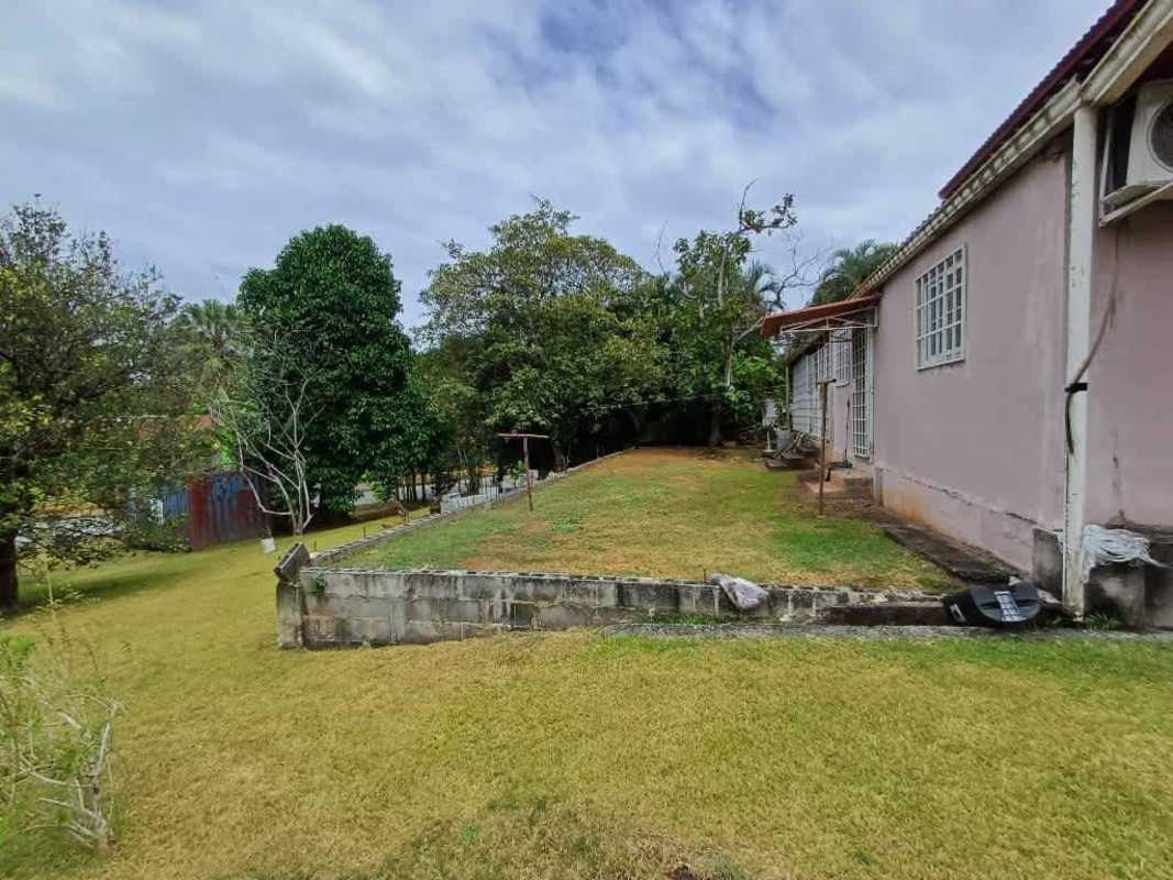 Covered terrace overlooking large backyard garden in Albrook Canal house for sale