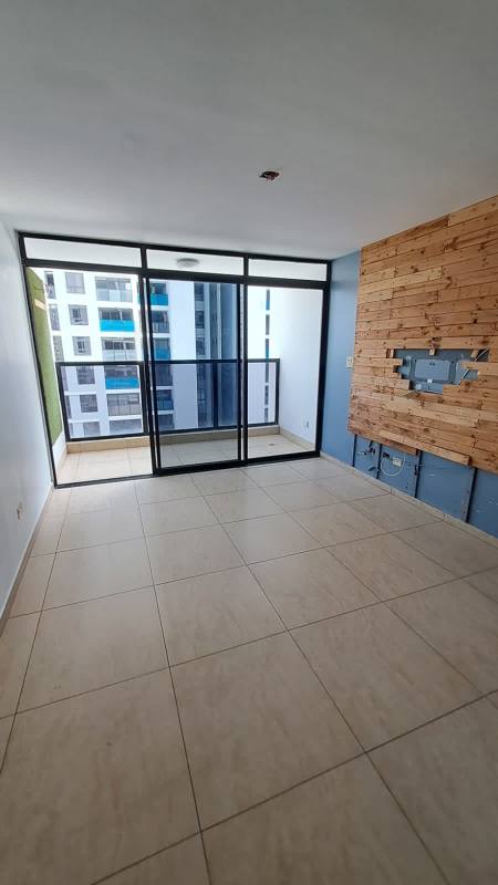 Bright living area with large sliding doors leading to balcony at PH Terrazas del Rey Condado del Rey Panama