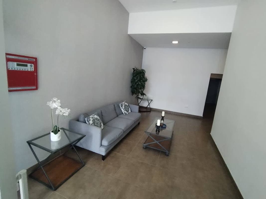Bright living room with ceramic tile floor, AC, ceiling fan and pendant light in PH Riverwalk El Crisol