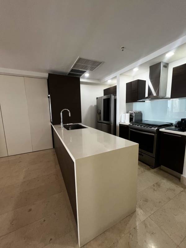 Modern kitchen with granite island, stainless appliances at Yoo Panama Panama City