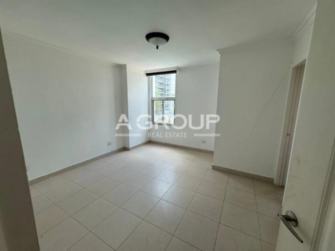 Kitchen with granite counters, stainless refrigerator, gas stove and cabinetry in Tao Tower apartment