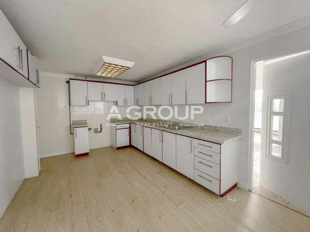 Bright modern kitchen white cabinets granite counters window Punta Paitilla