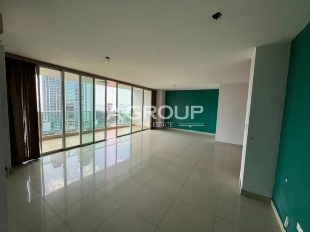 Spacious living room with balcony access and accent walls PH Sevilla Costa del Este Panama