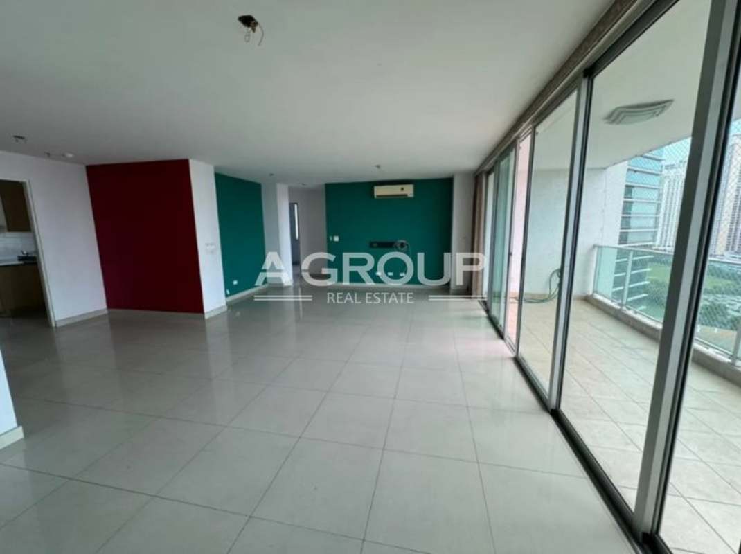 Modern living space with large sliding glass doors to balcony PH Sevilla Panama