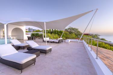 Spacious ocean view terrace with modern seating and white canopy at Vista Mar Panama