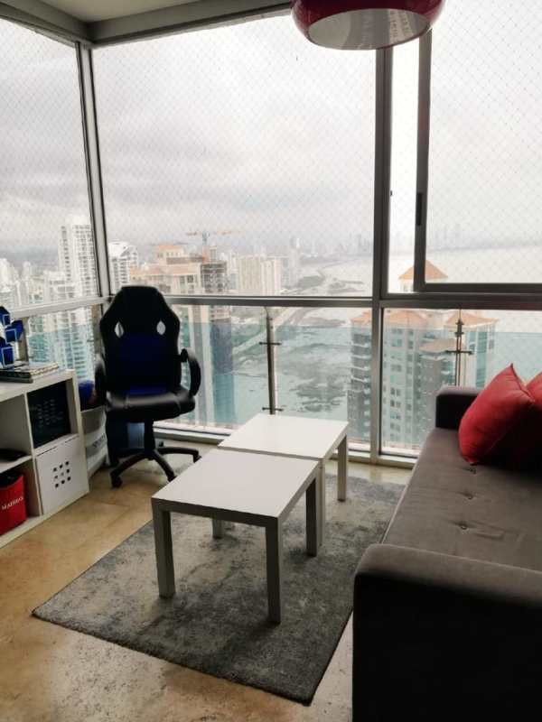 Living room with floor-to-ceiling windows, panoramic sea and skyline views at PH Aqualina Punta Pacifica