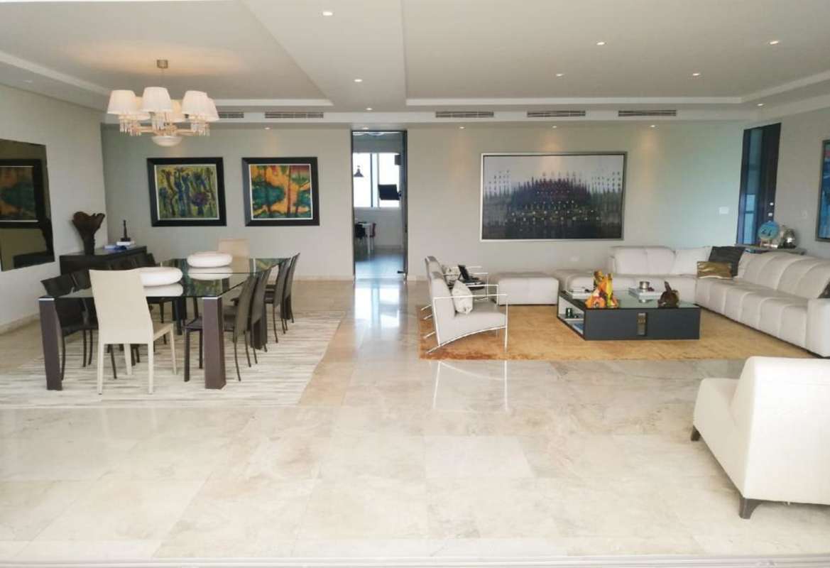 Elegant dining room with glass table, marble flooring, sea view windows PH Aqualina Punta Pacifica Panama