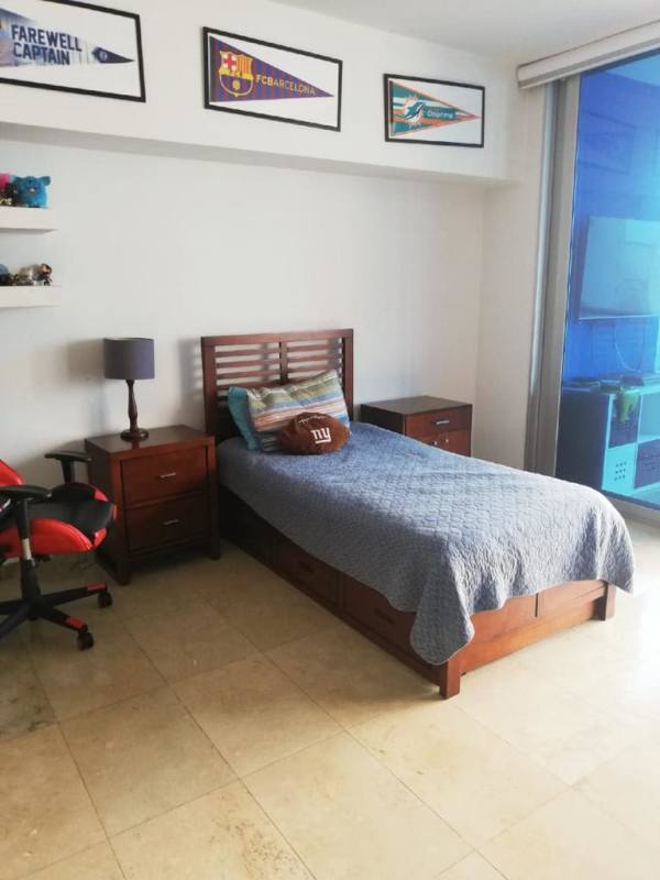 Contemporary bathroom with glass shower, marble tile and wood vanity in PH Aqualina Punta Pacifica Panama