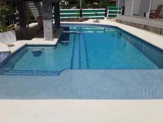 Swimming pool with sun deck and tile accents luxury estate Nueva Gorgona Panama