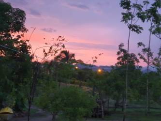 Beautiful sunset over trees at luxury beachfront estate Nueva Gorgona Panama