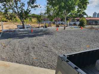 Large gravel-covered area with trees private estate Nueva Gorgona Panama