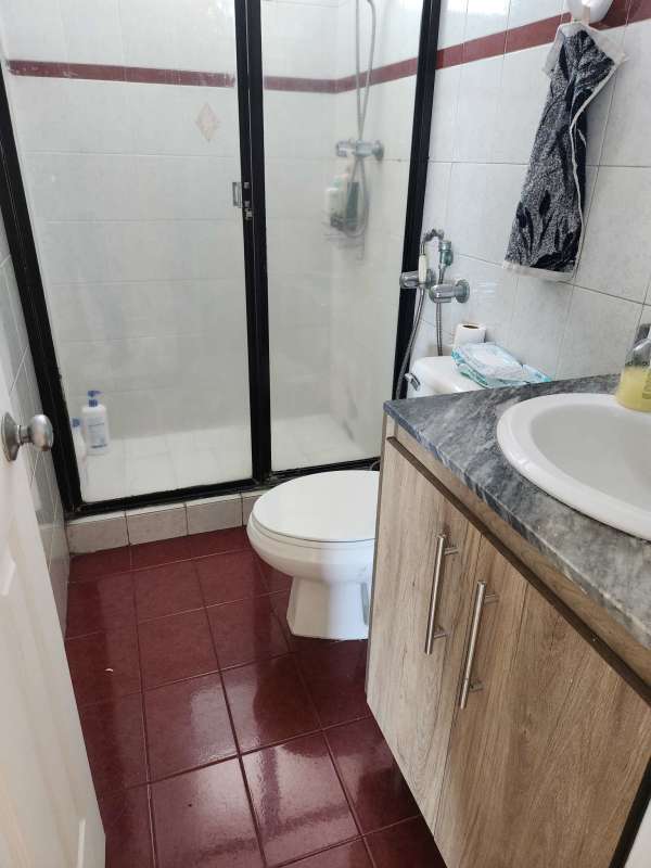 Living room with large windows, city views, tile floors, ceiling fan in Residencial Paitilla Panama City