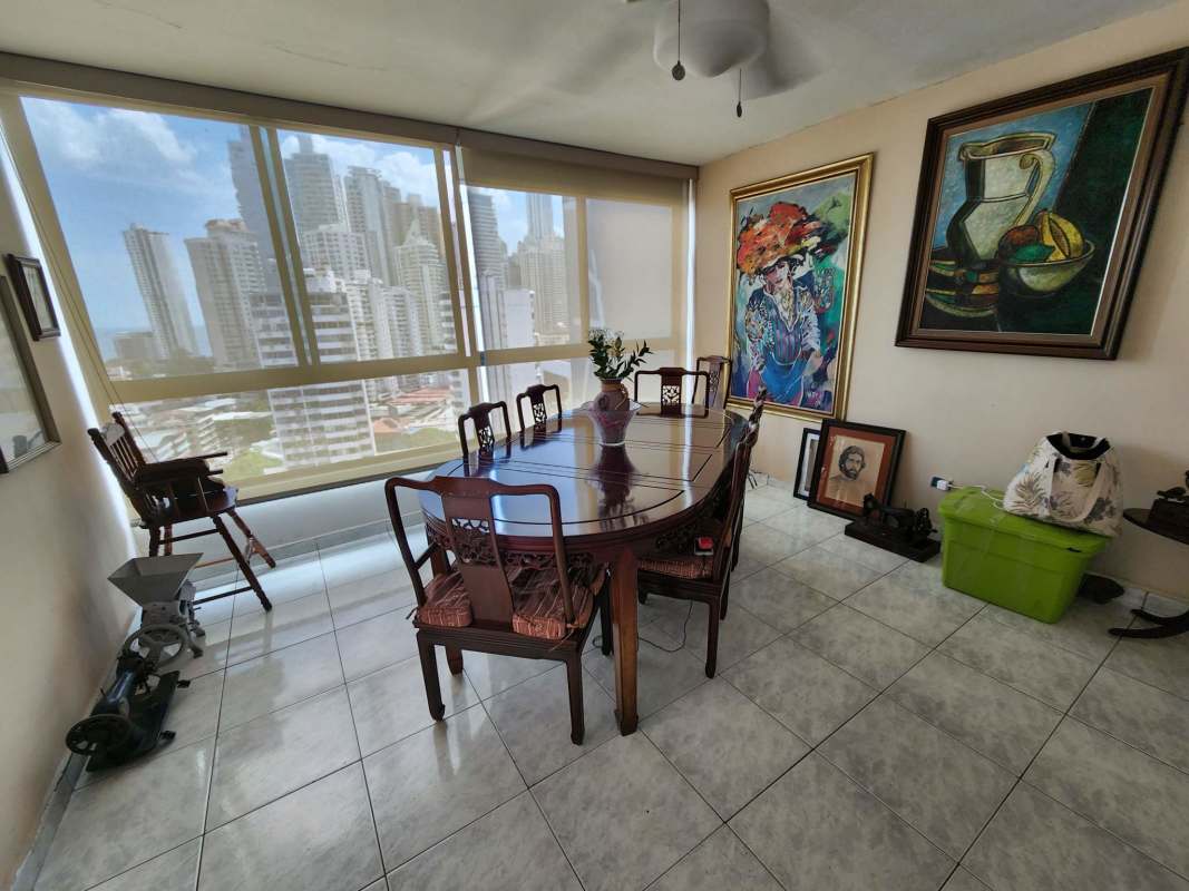 Bedroom with large window, tile floors, AC, overlooking Punta Paitilla skyline in Residencial Paitilla Panama City