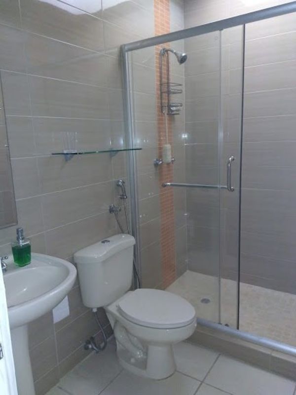 Updated bathroom with glass shower and tile walls PH Augusta Brisas del Golf Panama