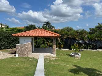 Covered terrace overlooking garden at Hacienda Pacífica San Carlos home for sale Panama