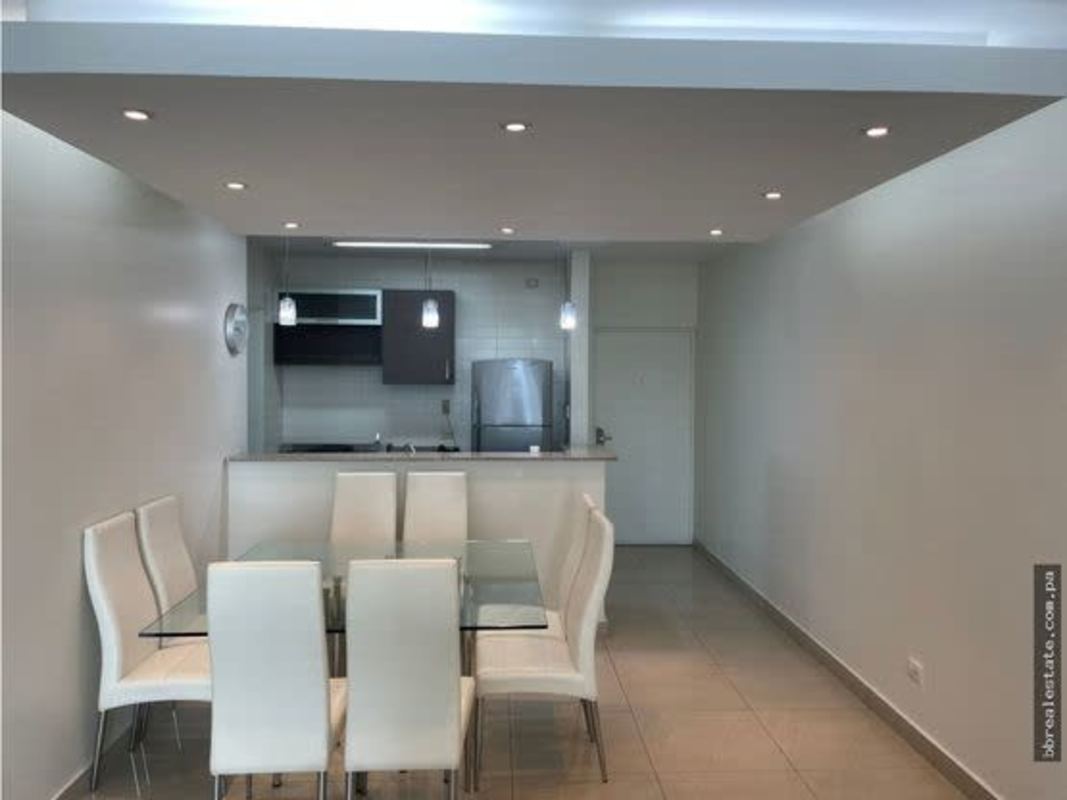 Open-plan dining area with modern kitchen granite counters PH Sun & Sky Panama