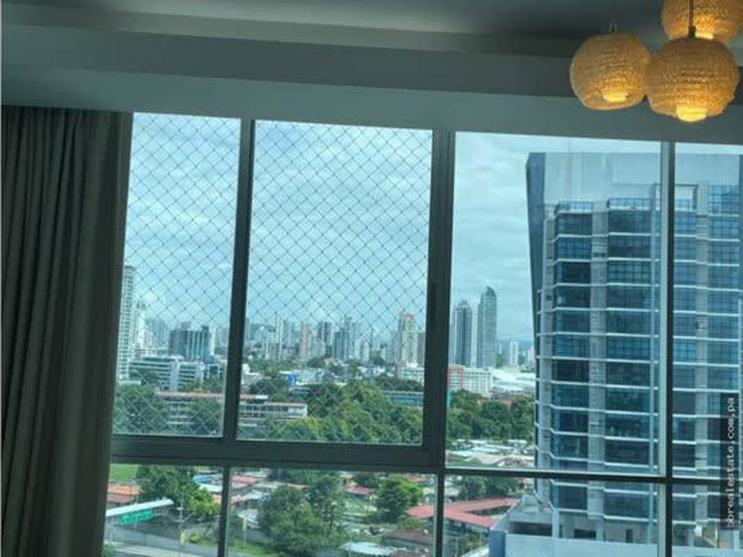 Living room with panoramic city skyline view windows PH Sun & Sky Punta Pacifica Panama