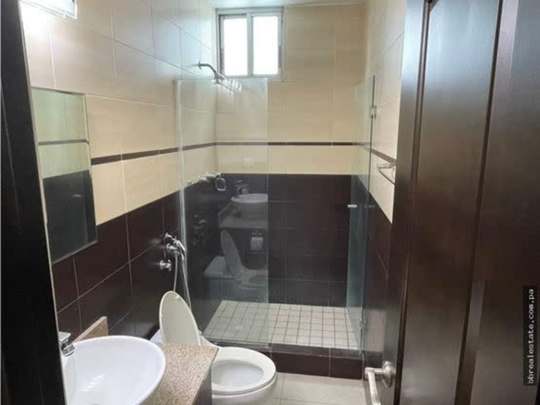 Modern bathroom with glass shower granite countertop vessel sink PH Sun & Sky Punta Pacifica Panama