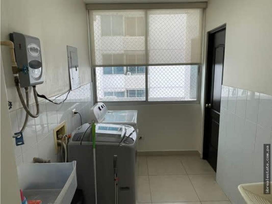 Laundry room with washer utility sink water heater PH Sun & Sky Punta Pacifica Panama
