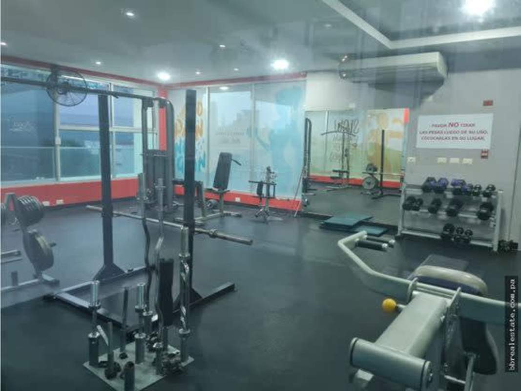 Fully equipped gym with weights cardio machines large mirrors PH Sun & Sky Panama