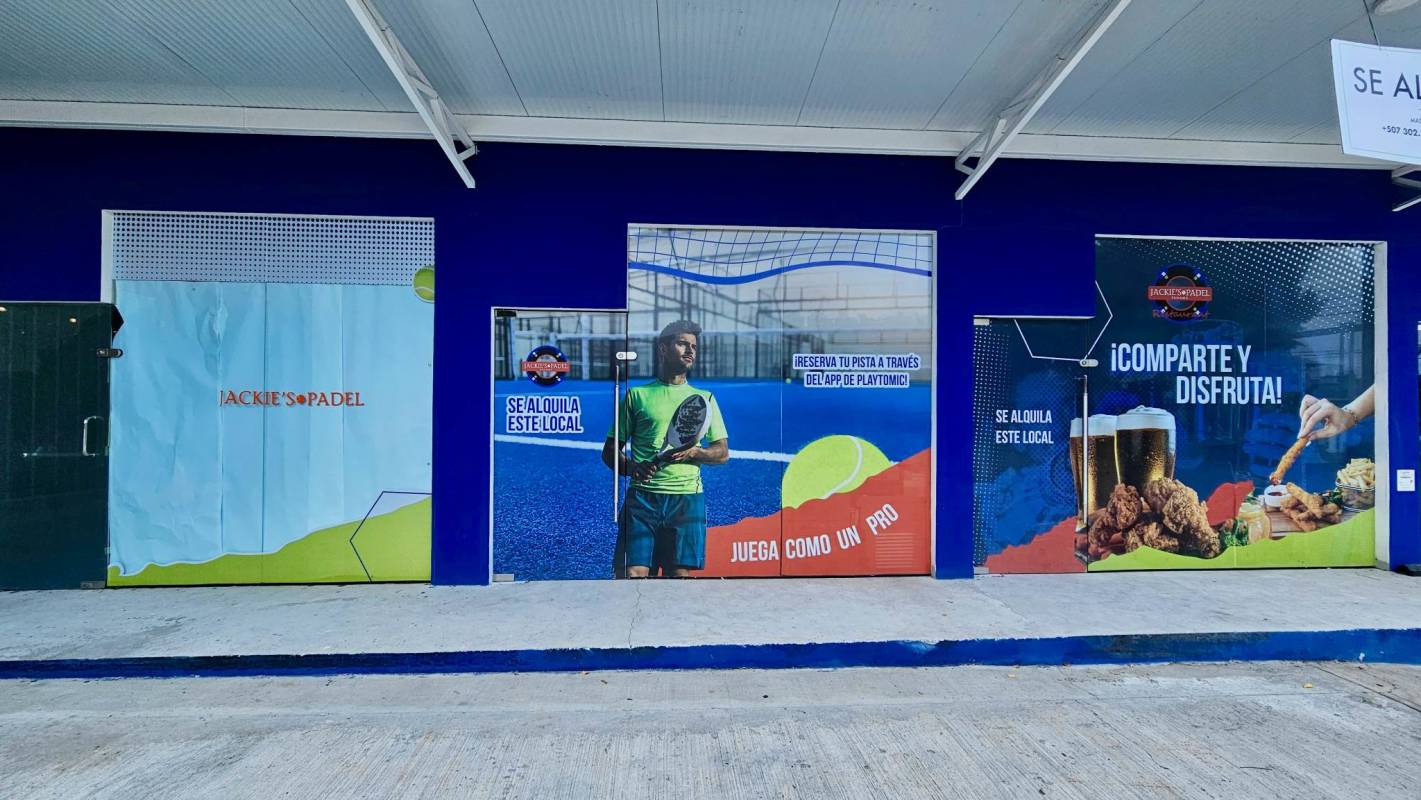 Retail units with sports-themed graphics and advertising banners at Jackie's Padel Chanis Panama
