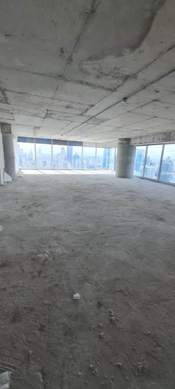 Unfinished shell office interior with panoramic ocean and skyline views in PH Oceania Business Plaza Panama