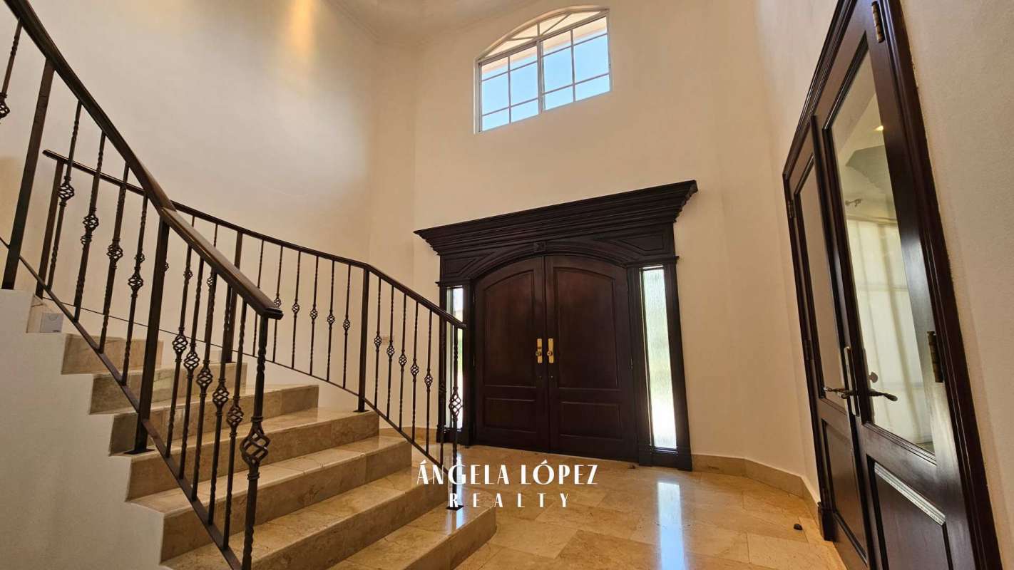 Open plan living area with garden and pool views in luxury Panama home