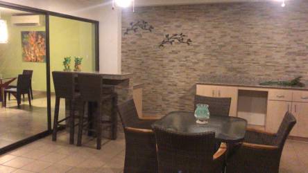 Large outdoor terrace with garden and pool views at PH Quetzal Punta Barco Panama