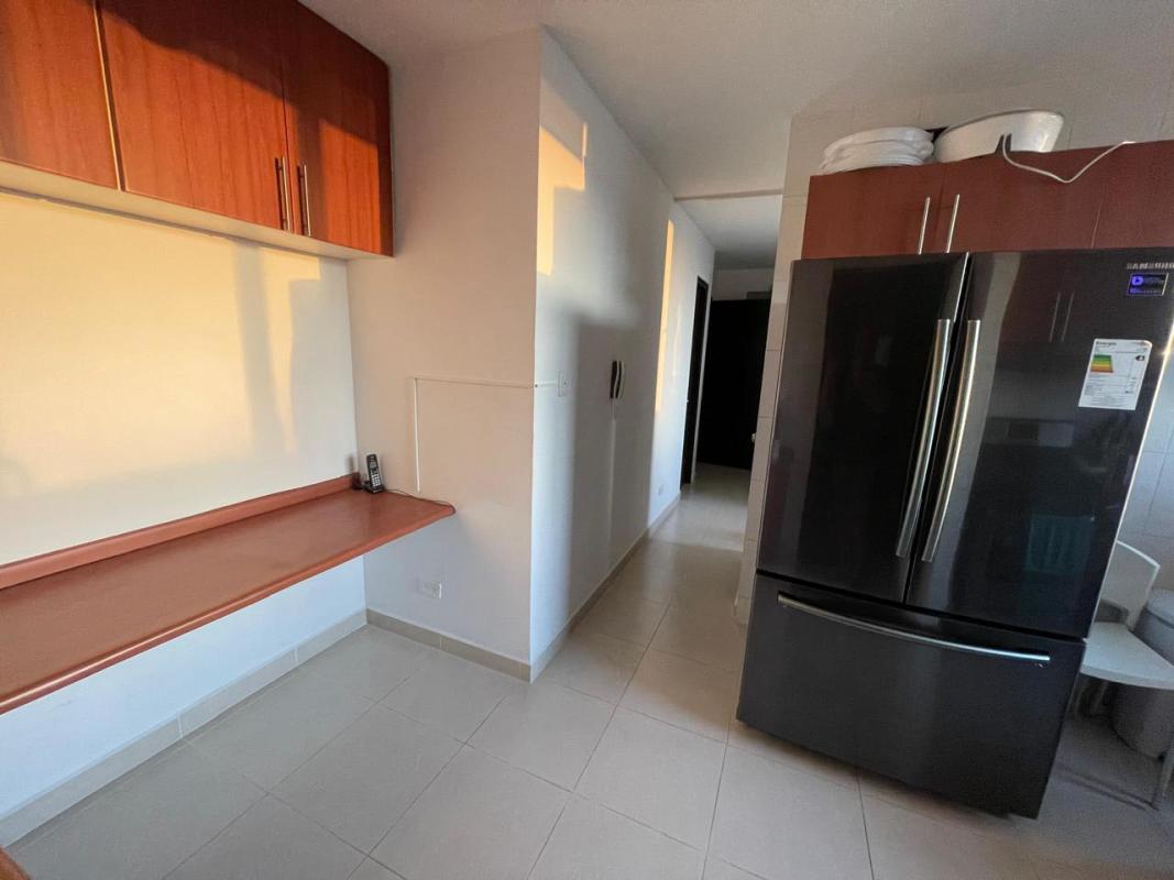 Kitchen with wooden cabinets and refrigerator in PH Veranda Coco del Mar Panama