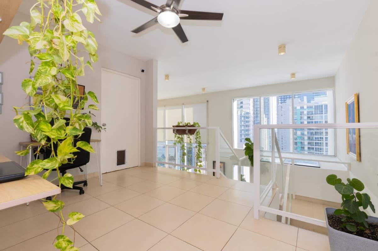 Second bedroom with skyline view from loft in PH Blue Park Panama City apartment for sale