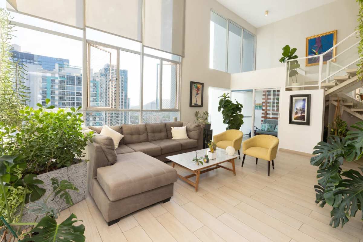 Loft living room double height with floor to ceiling windows in PH Blue Park Panama