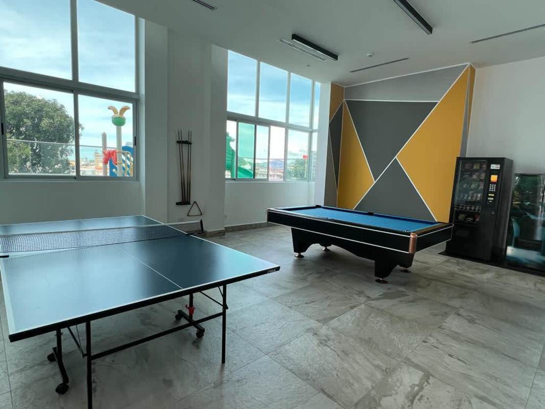 Contemporary lobby entrance with glass doors, marble accents at Altamira Residences Avenida Balboa