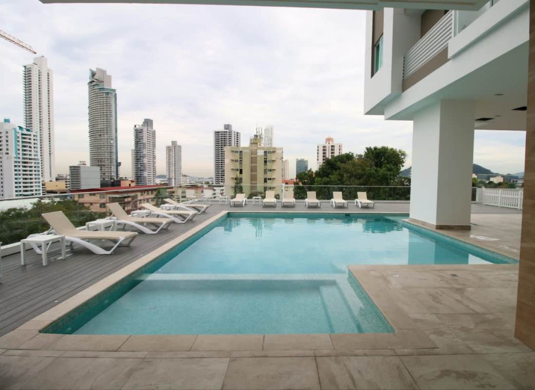 Rooftop children’s play area with colorful equipment and skyline backdrop at Altamira Residences Panama