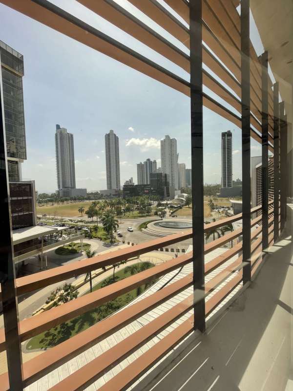 Gray shell open floor commercial office with exposed ceiling pipes in Torre Palmeras Costa del Este