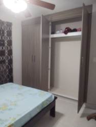 Simple bedroom with ceiling fan, curtains, closet in Isla Montelimara Costa Verde