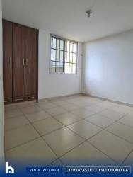 Modern kitchen with granite countertops and wood cabinetry in apartment Terrazas del Oeste La Chorrera Panama