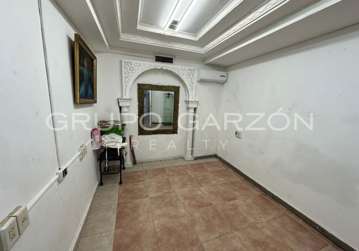 Interior storage area with metal racks and tiled floor commercial building San Francisco Panama