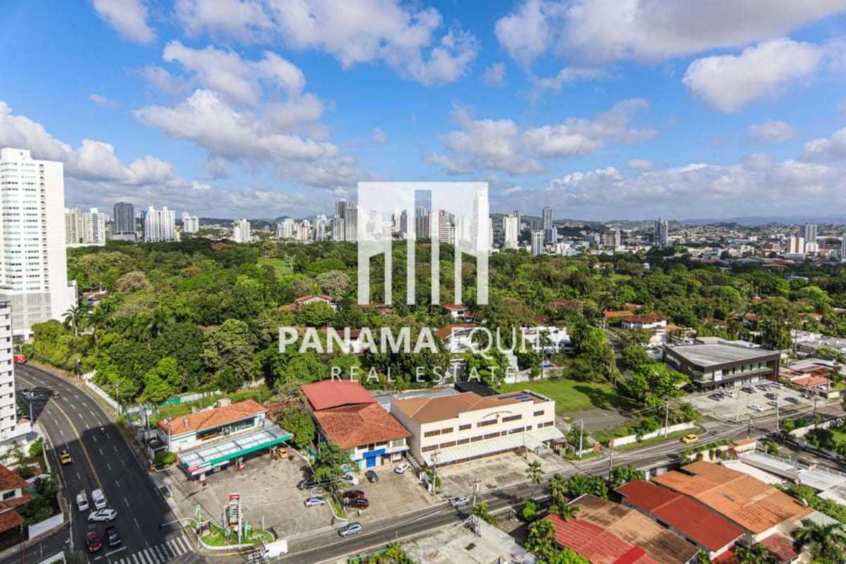 Spacious master bedroom loft with double-height windows and city views at Park Loft Panama
