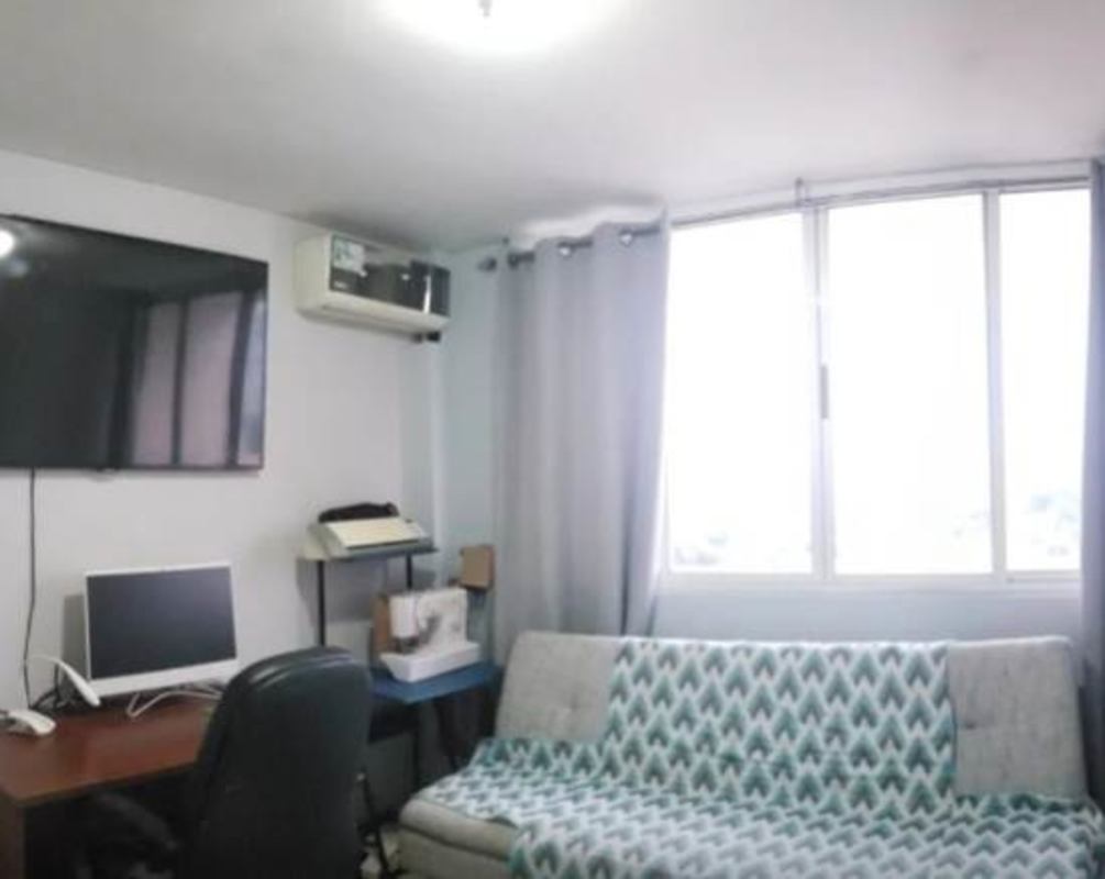 Living space with office desk, sofa, TV PH RIM Tower Panama City