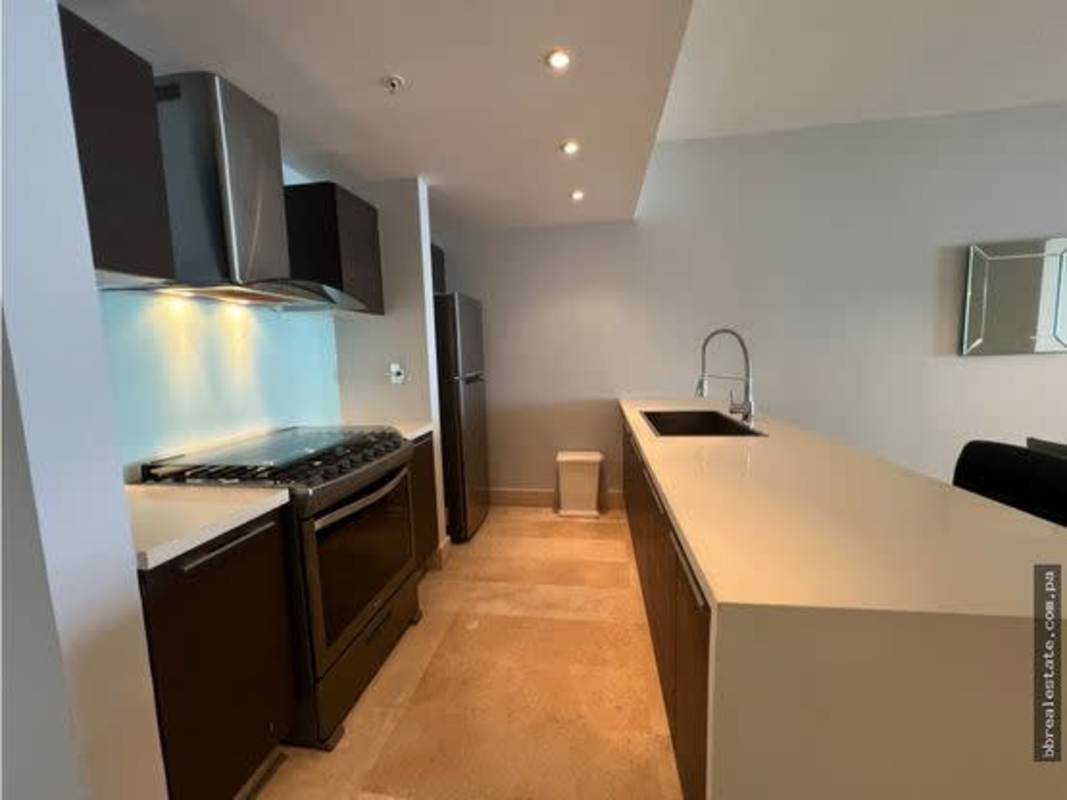 Modern kitchen with island, built-in appliances in PH YOO Panama luxury apartment