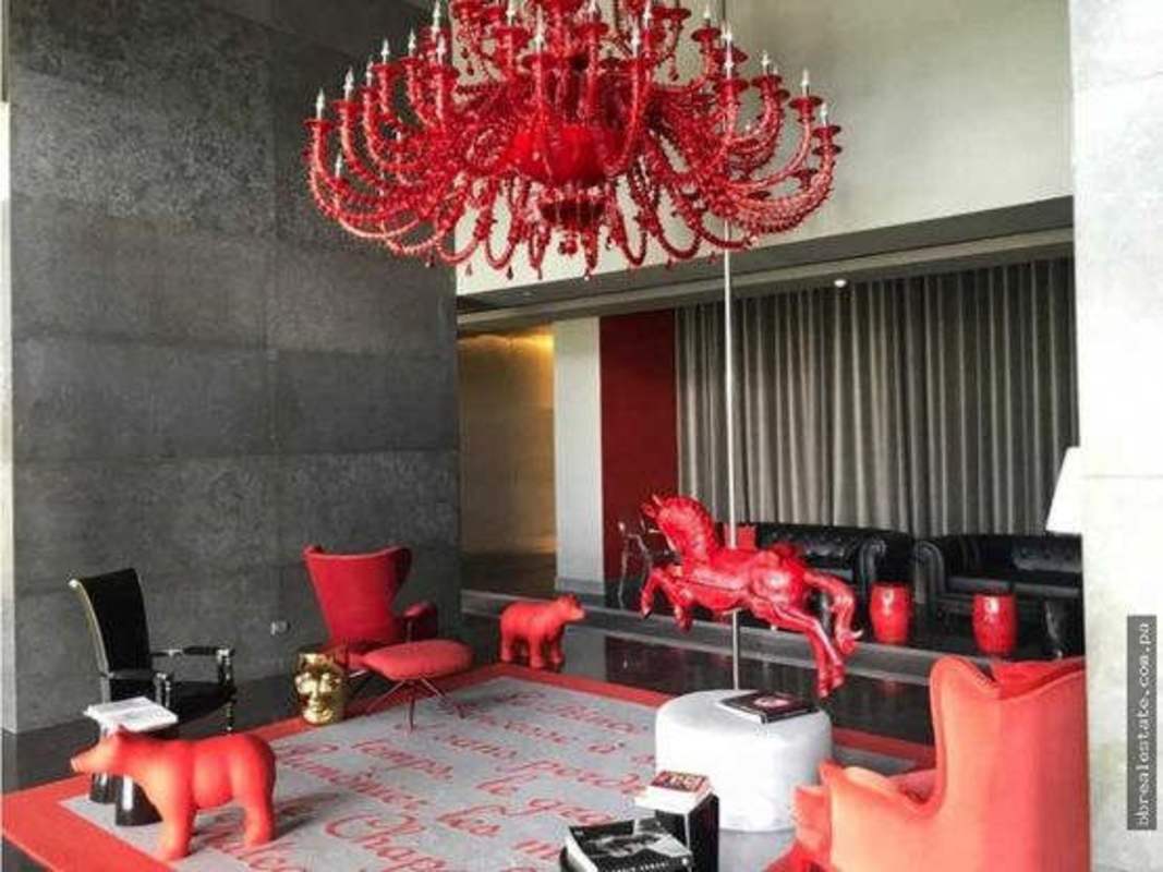 Large bedroom with floor-to-ceiling windows ocean city view PH YOO Panama