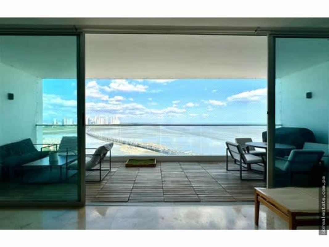 Wide balcony with glass railings and panoramic Pacific ocean view PH Ocean Sky Panama City