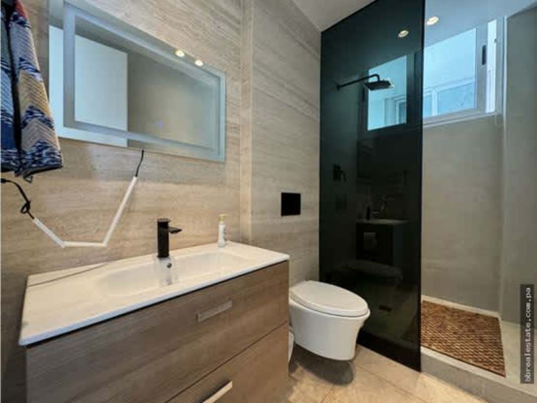 Contemporary guest bathroom with floating vanity and walk-in shower at PH Ocean Sky Panama