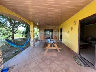 Traditional kitchen with wood cabinetry window and ceramic tile Santa Ana Los Santos Panama