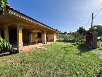 Yellow single-story house with tiled porch and garden in Santa Ana countryside Panama for sale