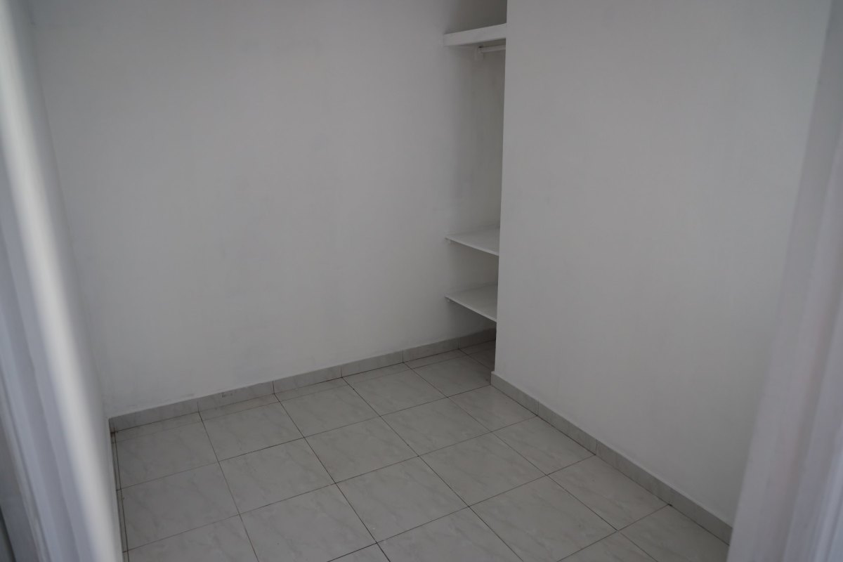 Spacious walk-in closet with built-in drawers in master suite PH Brisas Obarrio Panama City