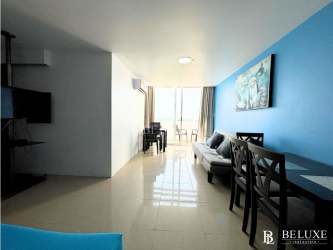 Modern kitchen with granite countertops, appliances in Playa Blanca PH Town Center condo