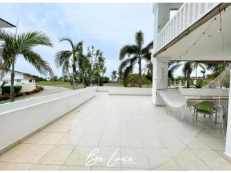 Open kitchen with granite counters and wood cabinets in beachfront condo PH Islamar Vistamar Panama