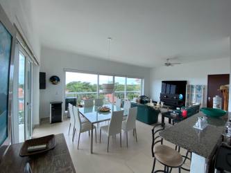 Bright bedroom with large windows and balcony mountain views Punta Barco Village Panama